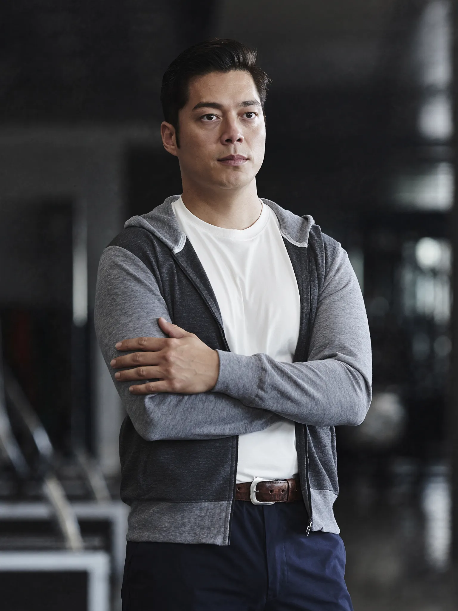 Confident gym trainer ready to help