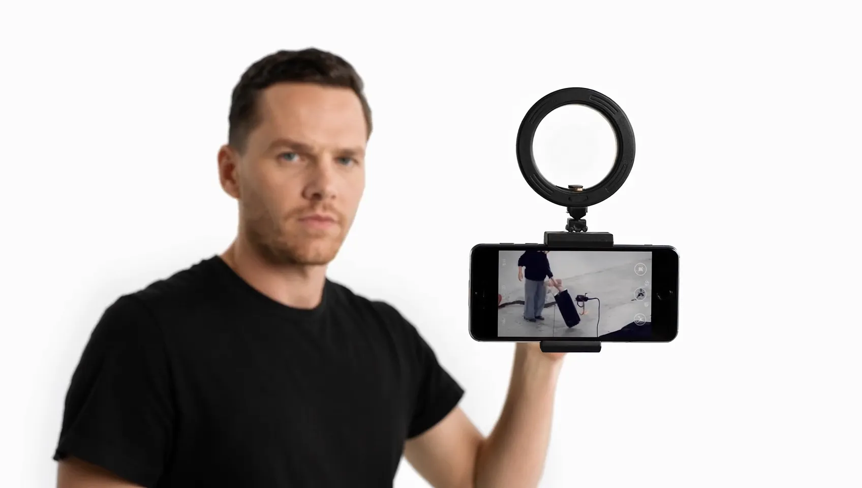 Creator filming a product demo Reel with a phone and ring light for Instagram marketing