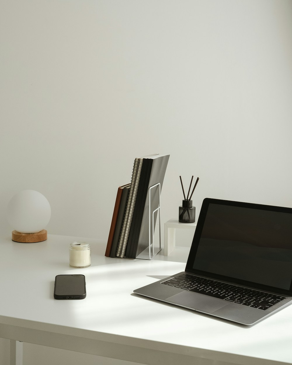 Minimal desk with a laptop open